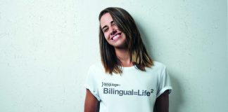 Girl wearing "Bilingual = Life Square" T-shirt